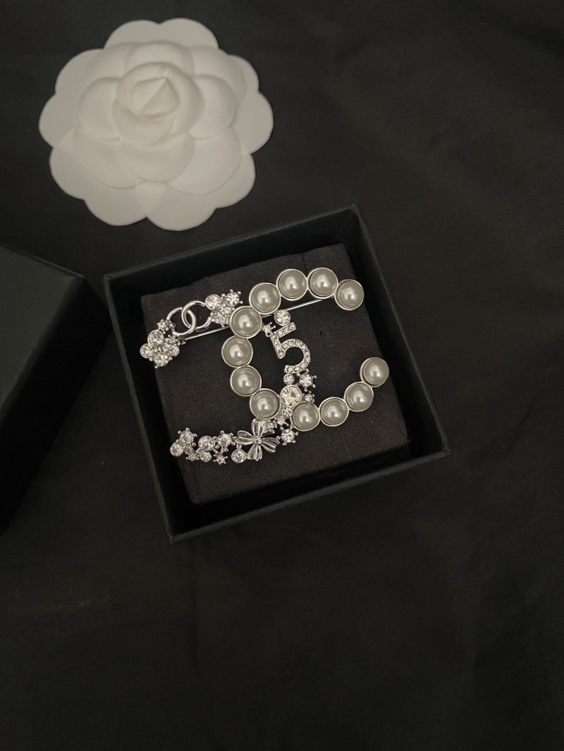 Ch**el brooches
